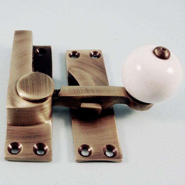 THD157/AB • Non-Locking • Antique Brass • Quadrant Ceramic Knob Sash Fastener
